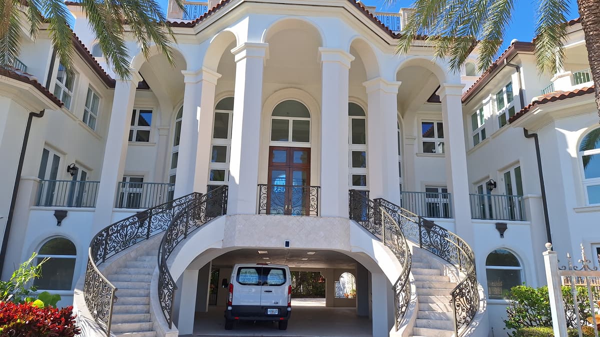 South Florida Window Cleaning van at luxury home exterior